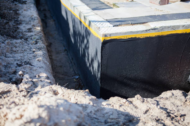 Professional Waterproofing technician working in Olney, MD